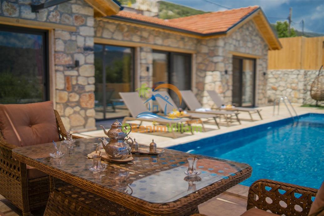 Villa HARMONİA Sarıbelen, Taş yapı mimarili, çocuk oyun alanlı, korunaklı havuzlu